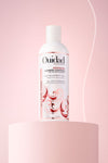 Ouidad Advanced Climate Control® Heat & Humidity Gel on platform against a pink background